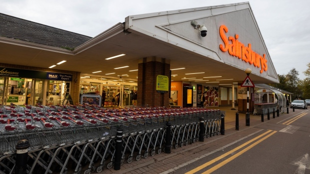 A sign outside the entrance a J Sainsbury Plc supermarket in Hemel Hempstead, UK, on Monday, Oct. 31, 2022. Sainsbury's are due to report their latest earnings on Nov. 3. Photographer: Chris Ratcliffe/Bloomberg