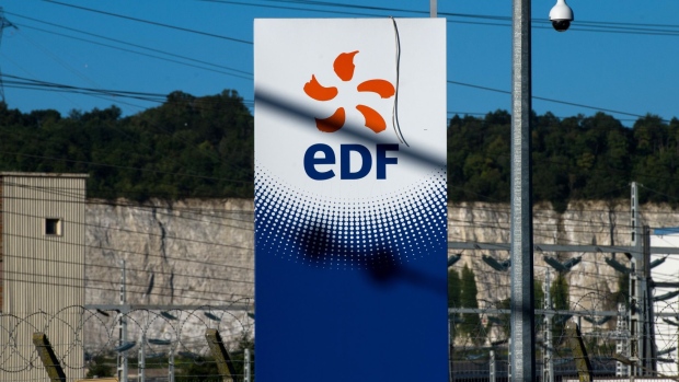 A sign outside the decomissioned Porcheville fuel power plant, operated by Electricite de France SA (EDF), in Porcheville, France, on Friday, July 8, 2022. The French government will nationalize its financially struggling nuclear giant Electricite de France SA to help it ride out Europe’s worst energy crisis in a generation and invest in new atomic plants. Photographer: Nathan Laine/Bloomberg