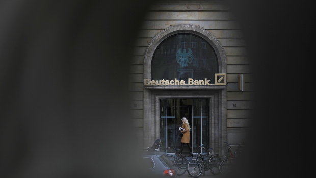 Signage for Deutsche Bank AG at the bank's headquarters in the financial district of Frankfurt, Germany, on Friday, May 6, 2022. European banks are counting the rising costs of Russia’s invasion of Ukraine as the war pushes up commodity prices and disrupts corporate supply chains. Photographer: Alex Kraus/Bloomberg