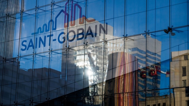 Signage for Cie. de Saint-Gobain at the company's headquarters in the Saint-Gobain Tower in the La Defense business district of Paris, France, on Thursday, June 16, 2022. The global building materials manufacturer is likely to surprise the market again and keep its upward growth trajectory above expectations, according to Bloomberg Intelligence. Photographer: Nathan Laine/Bloomberg