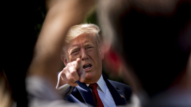 U.S. President Donald Trump takes a question while speaking to members of the media before boarding Marine One on the South Lawn of the White House in Washington, D.C., U.S., on Wednesday, Aug. 21, 2019. Trump said he canceled his trip to Denmark after a "nasty" comment by the country's prime minister.