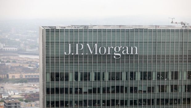 A logo sits outside the offices of JPMorgan Chase & Co. in the Canary Wharf business and shopping district in London, U.K., on Wednesday, May 17, 2017. JPMorgan Chase & Co. plans to move hundreds of London-based bankers to expanded offices in Dublin, Frankfurt and Luxembourg to preserve easy access to the European Union’s single market after Brexit, the firm's head of investment banking said earlier in May. Photographer: Simon Dawson/Bloomberg