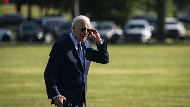 U.S. President Joe Biden adjusts his sunglasses as he walks across the Ellipse near the White House after exiting Marine in Washington, D.C., on Thursday, May 27, 2021. Biden is set to unveil a budget that would see federal spending jump to $6 trillion in the coming fiscal year, with annual deficits of more than $1.3 trillion over the next decade, according to documents cited by the New York Times.