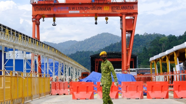 A security personnel at the Genting tunnel construction site, part of the East Coast Rail Link (ECRL) project built by China Communications Construction Co., in Bentong, Pahang, Malaysia, on Thursday, June 23, 2022. Construction work on Malaysia’s East Coast Rail Link is progressing and is expected to hit the 37% mark by year-end, Transport Minister Wee Ka Siong said today.