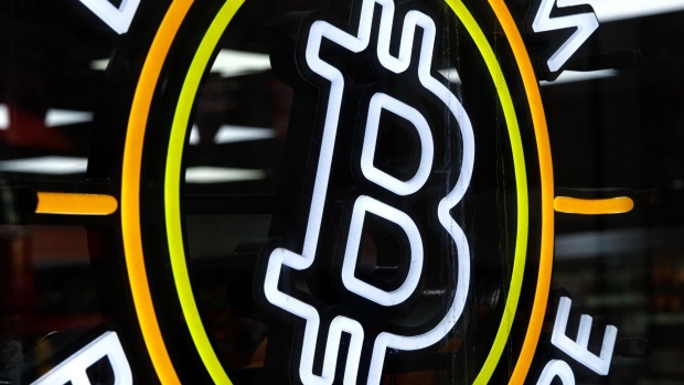 A neon sign advertising the availability of a bitcoin automated teller machine (ATM) at a Texaco petrol station in London, U.K., on Friday, Feb. 4, 2022. Getting to grips with crypto on your annual tax bill is already a tough nut to crack, but the U.K. tax authorities are about to make it even harder. Photographer: Luke MacGregor/Bloomberg