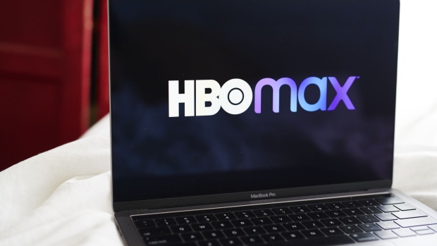 Signage for the AT&T Inc. WarnerMedia HBO Max streaming service is displayed on a laptop computer in an arranged photograph taken in the Brooklyn Borough of New York, U.S., on Thursday, May 28, 2020. About 90,000 people downloaded the HBO Max mobile app on its first day, Wednesday, according to the measurement firm SensorTower Inc. Photographer: Gabby Jones/Bloomberg