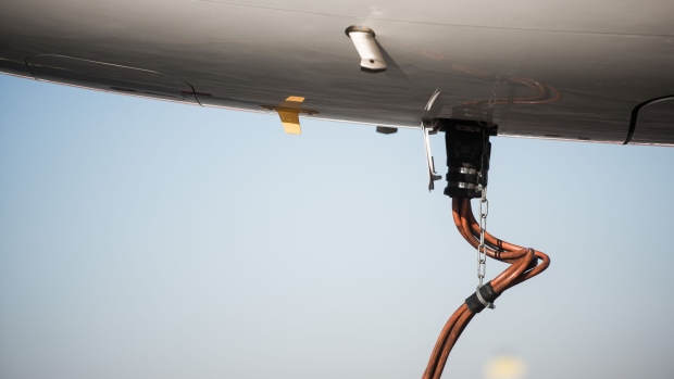 A refueling pipe sits connected to the tank of an Airbus A321-231 passenger aircraft, operated by Wizz Air Holdings Plc, at Liszt Ferenc airport in Budapest, Hungary, on Monday, Jan. 9, 2017. Wizz Air, the No. 1 no-frills carrier in Eastern Europe, grew passenger numbers 19 percent to 23 million as it added more destinations in the west of the continent. Photographer: Akos Stiller/Bloomberg