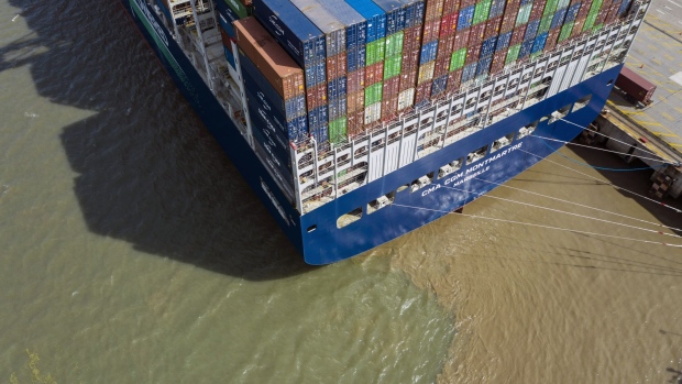 A container ship at the Yangshan Deepwater Port in Shanghai, China, on Tuesday, July 5, 2022. Senior US and Chinese officials discussed US economic sanctions and tariffs Tuesday amid reports the Biden administration is close to rolling back some of the trade levies imposed by former President Donald Trump. Photographer: Qilai Shen/Bloomberg