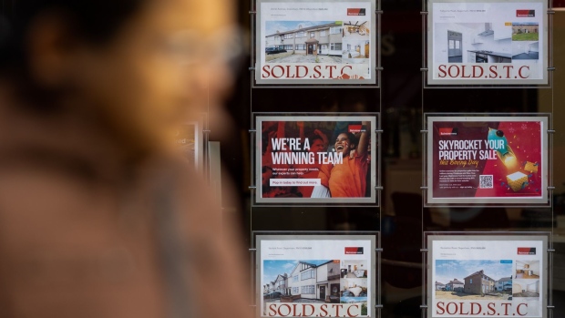 Property advertisements with "Sold STC (subject to contract)" signs in the window of an estate agents in Dagenham, UK, on Wednesday, Nov. 23, 2022. Barking and Dagenham is the only remaining London borough where house prices in the resale market have risen by double digits. Photographer: Chris Ratcliffe/Bloomberg