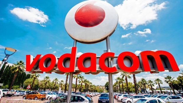 A Vodacom logo sits on display outside the Vodacom World mall, operated by Vodacom Group Ltd., in the Midrand district of Johannesburg, South Africa, on Thursday, Feb. 2, 2017. Vodacom, which is 65 percent owned by Newbury, England-based Vodafone and the South African market leader by subscriber numbers, is expanding its internet offering to offset falling voice revenue.
