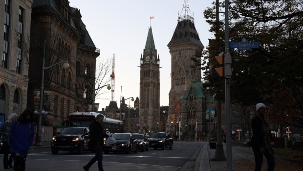 Centre Block and East Block of Parliament Hill in Ottawa, Ontario, Canada, on Tuesday, Nov. 1, 2022. Canada's economic growth rate fell by half in the third quarter, ahead of what's expected to be an even sharper downturn later this year. Photographer: David Kawai/Bloomberg