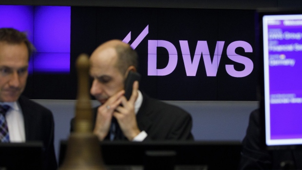 A DWS Group logo sits on display as Deutsche Bank AG make an initial public offering (IPO) of shares for its asset-management division at the Frankfurt Stock Exchange, operated by Deutsche Boerse AG, in Frankfurt, Germany, on Friday, March 23, 2018. DWS held its ground on the first day of trading after parent Deutsche Bank raised about 1.4 billion euros ($1.7 billion) from an initial public offering. Photographer: Alex Kraus/Bloomberg