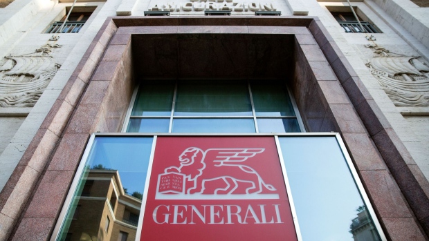 An Assicurazioni Generali SpA logo sits above an entrance to their offices in Rome, Italy, on Friday, Jan. 27, 2017. Intesa Sanpaolo SpA Chief Executive Officer Carlo Messina, whose bank is considering a merger with insurer Assicurazioni Generali SpA, vowed to defend Italy's national interest. Photographer: Alessia Pierdomenico/Bloomberg