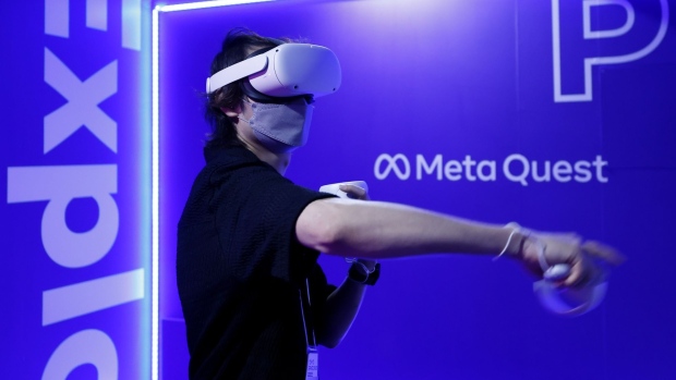 An attendee wears a Meta Quest 2 virtual reality (VR) headset to play a video game at the Tokyo Game Show 2022 in Chiba, Japan, on Thursday, Sept. 15, 2022. The show runs through to Sept. 18.