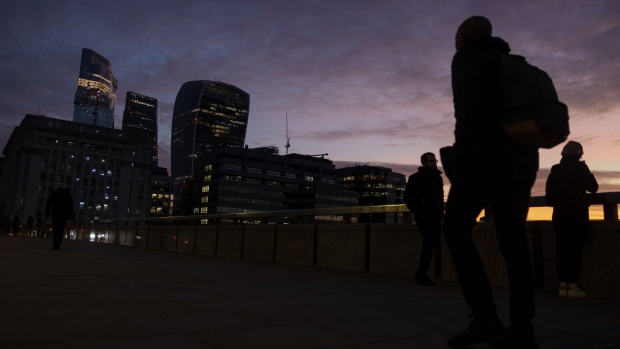 Commuters walk along London Bridge in the City of London, UK, on Monday Oct. 3, 2022. Traders are the most negative ever on the pound’s prospects, even after the UK government scrapped one of its new tax policies, a sign it will take a bigger policy U-turn to restore credibility with markets.