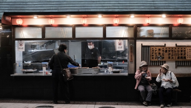 Customers in front of a yakitori store in Tokyo, Japan, on Wednesday, Oct. 19, 2022. September figures due Friday are expected to show Japan’s key inflation gauge hitting 3%, the highest in about 30 years after factoring out tax distortions.