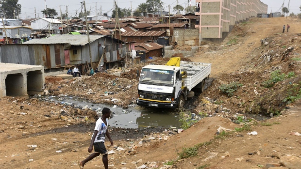 A truck transports bricks for the construction of new homes for slum dwellers in the Kibera slum in Nairobi, Kenya, on Friday, July 21, 2017. Kenya, East Africa’s biggest economy, has faced questions about the credibility of its past two elections, with a dispute over the outcome of a presidential vote in December 2007 triggering two months of ethnic violence that left at least 1,100 people dead. Photographer: Riccardo Gangale/Bloomberg