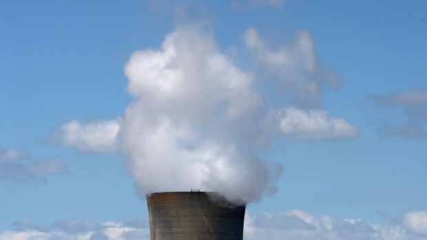 Vapor rises from a cooling tower at the EnergyAustralia Pty. Yallourn Power Station in the Latrobe Valley, Australia, on Tuesday, Oct. 26, 2021. Australia’s Prime Minister finally agreed to a plan to zero out its carbon emissions by 2050, but said he wouldn’t enshrine the target in law, and would continue to rely on fossil fuels and projects designed to offset planet-warming pollution. Photographer: Carla Gottgens/Bloomberg
