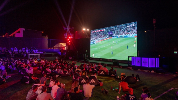 Fans watch the FIFA World Cup 2022 match between Iran and USA at the BudX FIFA Fan Festival at Dubai Harbour in Dubai, United Arab Emirates, on Wednesday, Nov. 30, 2022. Doha is expected to welcome more than 1 million fans during the FIFA World Cup 2022, but many of them will be staying in Dubai and other surrounding cities, taking shuttle flights in for the day.