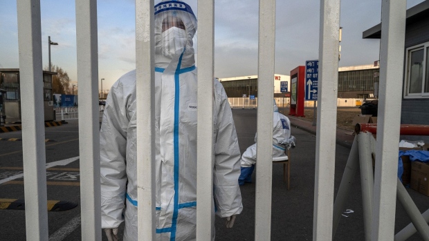 An epidemic control worker at a government quarantine facility in Beijing on Dec. 7.