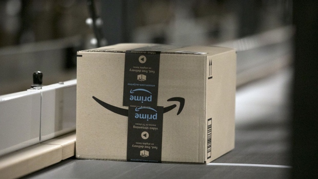 A box moves along a conveyor belt at an Amazon.com Inc. fulfillment center in Sydney, Australia, on Tuesday, July 5, 2022. Amazon.com Inc. became the third US tech giant to be subject to Germany's tough new antitrust rules targeting the dominance of a handful of powerful digital firms, and will also face a separate probe in the UK. Photographer: Brent Lewin/Bloomberg