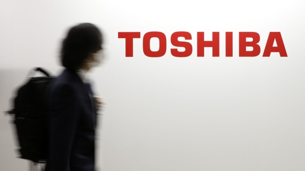 The Toshiba Corp. logo displayed on a wall at the Combined Exhibition of Advanced Technologies (CEATEC) in Chiba, Japan, on Tuesday, Oct. 18, 2022. CEATEC, the annual information technology and electronics trade show, will run through Oct. 21. Photographer: Kiyoshi Ota/Bloomberg