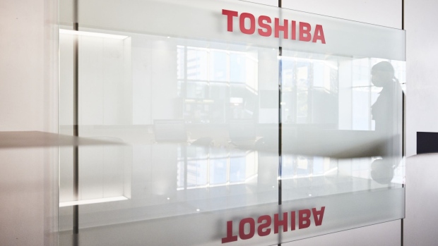Toshiba Corp. logo at the company's headquarters in Tokyo Japan, on Tuesday, Feb. 22, 2022. The top executive Satoshi Tsunakawa said selling the Japanese conglomerate to a fund and taking it private would be full of drawbacks that he can’t condone, stressing that splitting into two companies is the best plan even as activist investors call for a reopening of talks with private equity buyers. Photographer: Shoko Takayasu/Bloomberg