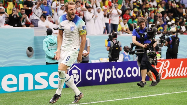 AL KHOR, QATAR - DECEMBER 04: Harry Kane of England celebrates after scoring the team's second goal during the FIFA World Cup Qatar 2022 Round of 16 match between England and Senegal at Al Bayt Stadium on December 04, 2022 in Al Khor, Qatar. (Photo by Clive Brunskill/Getty Images)