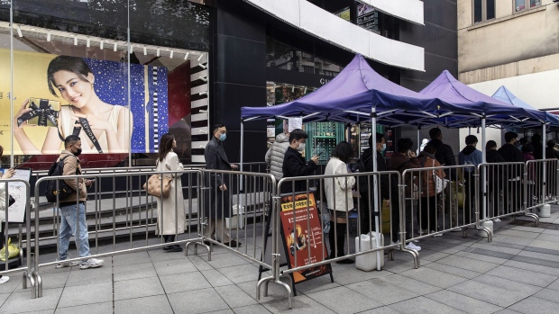 Residents queue at a Covid testing booth in Shanghai, China, on Wednesday, Dec. 7, 2022.