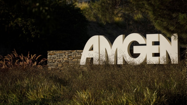 Signage is displayed outside Amgen Inc. headquarters in Thousand Oaks, California, U.S., on Thursday, Aug. 27, 2020. Amgen is among the world's biggest biotechnology companies with a market value of about $137 billion, though it's replacing a company -- Pfizer Inc. -- that is about $90 billion larger. Photographer: Patrick T. Fallon/Bloomberg