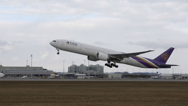 A passenger aircraft operated by Thai Airways International Pcl takes off from Munich airport in Munich, Germany, on Tuesday, Jan. 29, 2019. Deutsche Lufthansa AG has decided to speed up growth at Munich and develop it into a hub with a focus on Asia. Photographer: Michaela Handrek-Rehle/Bloomberg