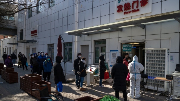 Residents queue at a fever clinic in Beijing, on Dec. 13.