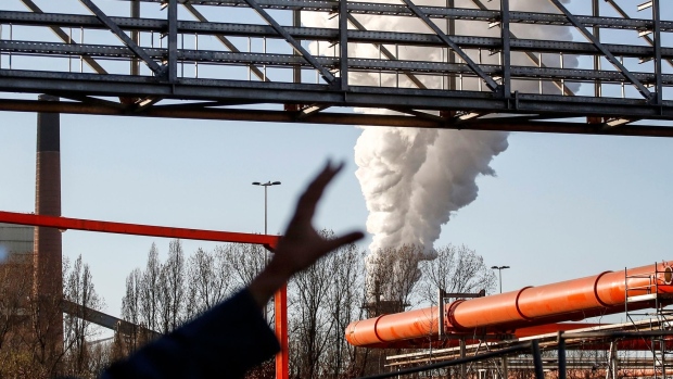 Vapor released from a chimney at the Carbalyst unit, which recycles recycles waste gasses into ethanol, at the ArcelorMittal SA Ghent steel plant in Ghent, Belgium, on Thursday, March 17, 2022. While the European Union discusses massive borrowing to finance energy projects that would help wean the bloc off its dependence on Russian gas, ArcelorMittal European Chief Executive Officer Geert Van Poelvoorde said using hydrogen to decarbonize the Ghent plant -- which produces 3.6% of the EU's steel -- would require "massive energy" with four gigawatts of power capacity. Photographer: Valeria Mongelli/Bloomberg