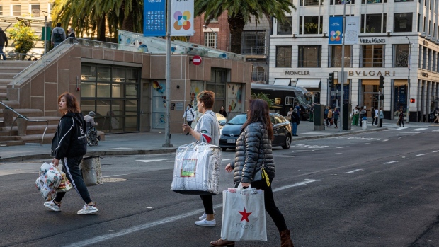 Shoppers cross Geary Street in San Francisco on Nov. 29.