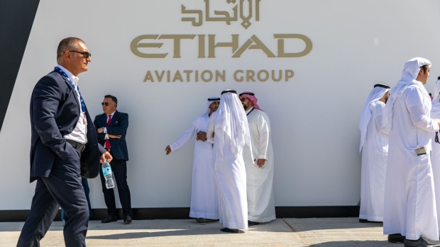 Attendees gather near the entrance to the Etihad Airways pavilion on the first day of the 16th Dubai Air Show at Dubai World Central (DWC) in Dubai, United Arab Emirates, on Sunday, Nov. 17, 2019. The Dubai Air Show is the biggest aerospace event in the Middle East, Asia and Africa and runs Nov. 17 - 21. Photographer: Christopher Pike/Bloomberg