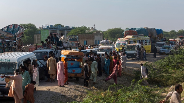 Traffic halts as people affected by the floods block the Indus Highway in protest, demanding food and shelters, in Sindh province, Pakistan on Wednesday, Aug. 31, 2022. Pakistan is facing a humanitarian crisis after unprecedented rainfall led to ongoing flooding that has inundated about a third of the country and left more than 1,100 people dead since June.