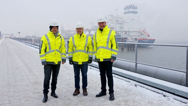 Robert Habeck, Germany's economy minister, left, Olaf Scholz, Germany's chancellor, center, and Christian Lindner, Germany's finance minister, visit the Hoegh Esperanza LNG floating storage regasification unit (FSRU), part of the Wilhemshaven LNG Terminal operated by Uniper SE, ahead of the terminal's inauguration in Wilhelmshaven, Germany, on Saturday, Dec. 17, 2022. The inauguration of the import terminal will mark an important step for Germany, which has been dependent on Russian pipeline gas for decades and suffered severely since the shipments have stopped this year.