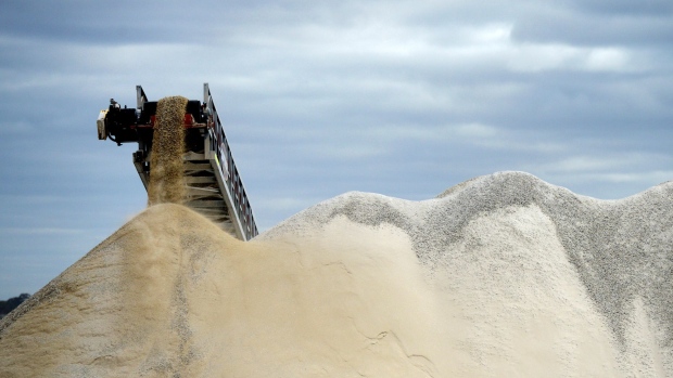 Lithium ore falls from a chute onto a stockpile at the Bald Hill lithium mine site, co-owned by Tawana Resources Ltd. and Alliance Mineral Assets Ltd., outside of Widgiemooltha, Australia, on Monday, Aug. 6, 2018. Australia’s newest lithium exporter Tawana is in talks with potential customers over expansion of its Bald Hill mine and sees no risk of an oversupply that would send prices lower.