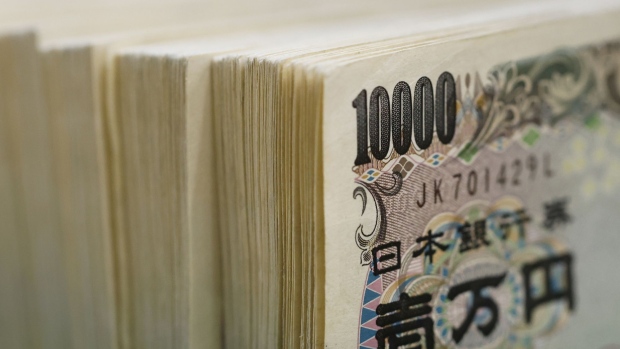 Japanese 10,000 yen banknotes, arranged at a branch of Resona Bank Ltd. in Tokyo, Japan, on Tuesday, Aug. 9, 2022. Dollar-yen, which soared 38% from a March 2020 trough to mid-July this year, is in retreat. Photographer: Kiyoshi Ota/Bloomberg