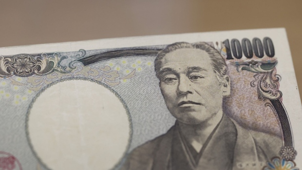 A Japanese 10,000 yen banknote arranged at a branch of Resona Bank Ltd. in Tokyo, Japan, on Tuesday, Aug. 9, 2022. Dollar-yen, which soared 38% from a March 2020 trough to mid-July this year, is in retreat. Photographer: Kiyoshi Ota/Bloomberg