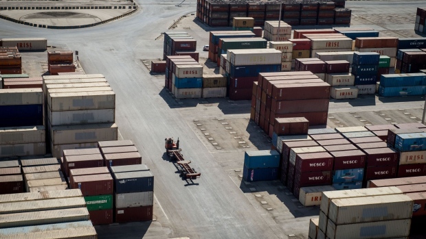 An empty shipping container carrier moves through a dockside storage area at Bandar Imam Khomeini (BIK) port in Bandar Imam Khomeini, Iran, on Thursday, May 23, 2019. Iranian officials have said that the raft of U.S. sanctions against their country, which was tightened last month, is aimed at fueling popular dissent in an effort to topple the leadership.