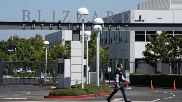 An protester walks across Blizzard Way during a walkout at Activision Blizzard offices in Irvine, California, U.S., on Wednesday, July 28, 2021. Activision Blizzard Inc. employees called for the walkout on Wednesday to protest the company's responses to a recent sexual discrimination lawsuit and demanding more equitable treatment for underrepresented staff.