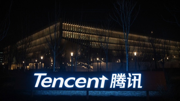 An illuminated logo at the Tencent Holdings Ltd. headquarters in Beijing, China, on Tuesday, March 16, 2021. China’s top leader warned that Beijing will go after so-called "platform" companies that have amassed data and market power, a sign that the months-long crackdown on the country’s internet sector is only just beginning. Photographer: Yan Cong/Bloomberg