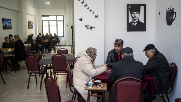 Residents play cards at a table inside a teashop in Eskisehir, Turkey, on Monday, Jan. 17, 2022. Turkey is set to pause its cycle of interest-rate cuts after a sliding currency and rising global energy prices pushed consumer inflation to its highest level since the beginning of President Recep Tayyip Erdogan’s rule. Photographer: Moe Zoyari/Bloomberg