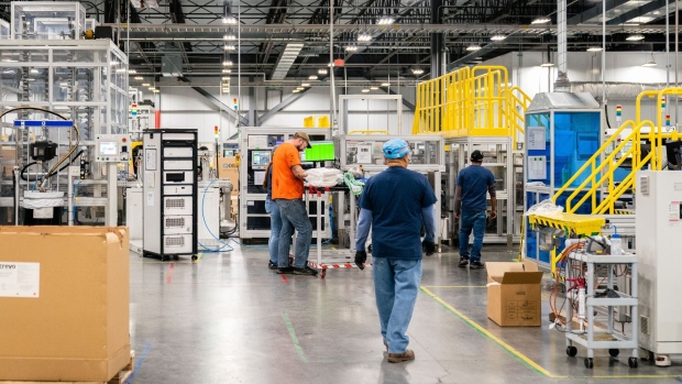 Employees work at the Hanwha Q Cells solar cell and module manufacturing facility in Dalton, Georgia, US, on Thursday, Oct. 6, 2022. Once a stronghold of the conservative South, Georgia has emerged as both a hub of so-called cleantech manufacturing and a political swing state.