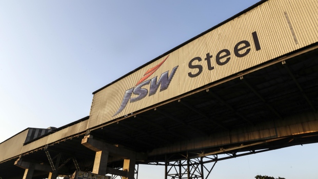 Signage for JSW Steel Ltd. is seen on the exterior of the company's manufacturing facility in Dolvi, Maharashtra, India, on Thursday, May 18, 2017. JSW, India's biggest producer, reported a jump in fourth-quarter profit, boosted by record output, and said it approved plans to raise about $2.5 billion in debt. Photographer: Dhiraj Singh/Bloomberg