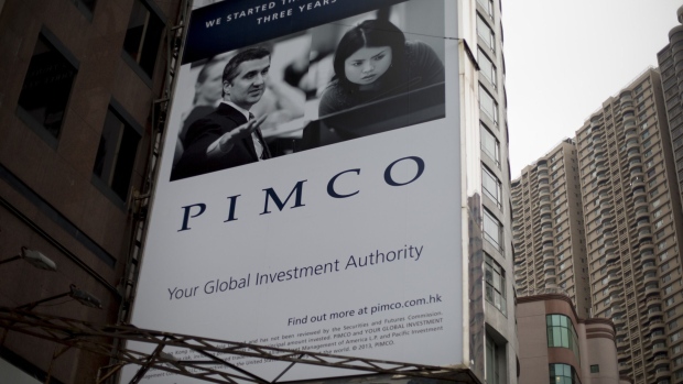 A Pacific Investment Management Company LLC (PIMCO) advertisement is displayed on a building in Hong Kong, China, on Wednesday, Nov. 13, 2013. Photographer: Brent Lewin/ 