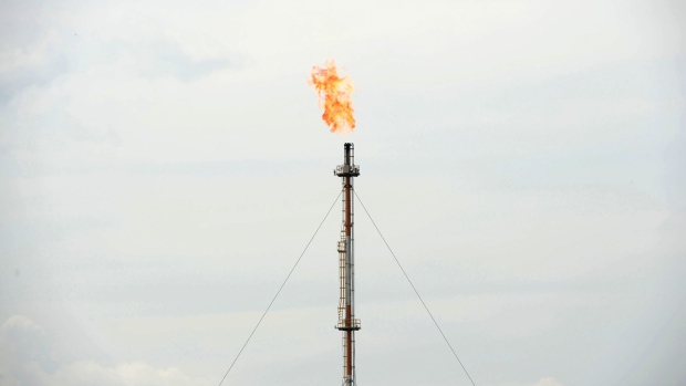 A flame from gas flare blazes on top of a flare stack at the Exxon Mobil Corp. Banyu Urip Central Processing Facility in the Cepu block of Bojonegoro, East Java, Indonesia, on Thursday, Dec. 8, 2016. Exxon is seeking to increase production from the Banyu Urip field to 200,000 barrels per day, according to Erwin Maryoto, Vice President of Public and Government Affairs at ExxonMobil Cepu. Photographer: Dimas Ardian/Bloomberg