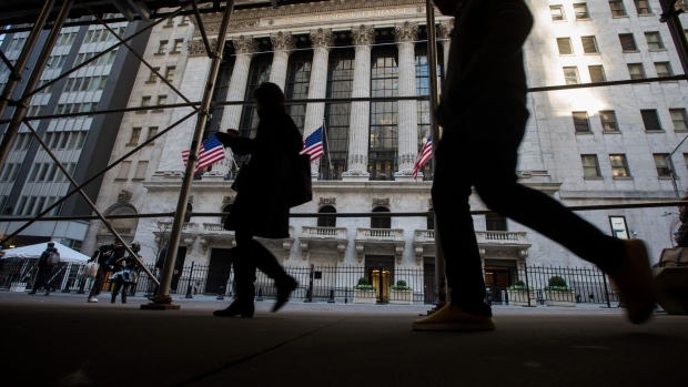 Pedestrians pass in front of the New York Stock Exchange (NYSE) in New York, US, on Wednesday, Nov. 9, 2022. US stocks declined following midterm elections that failed to yield a Republican sweep. Treasuries and the dollar caught bids in a sign of deteriorating risk sentiment. Photographer: Michael Nagle/Bloomberg