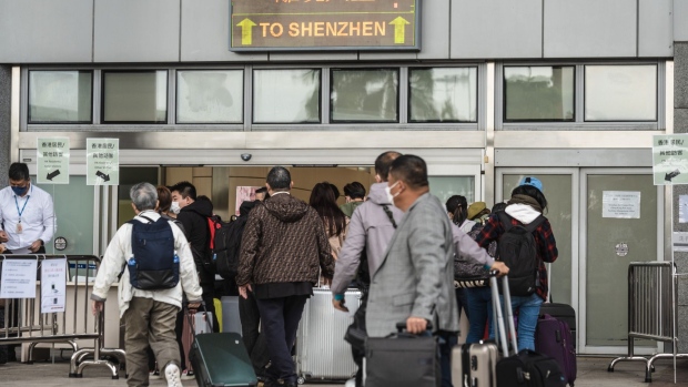 Travelers in the border control area at Shenzhen Bay Port, on the first day the border with mainland China is reopened, in Hong Kong, on Jan. 8.